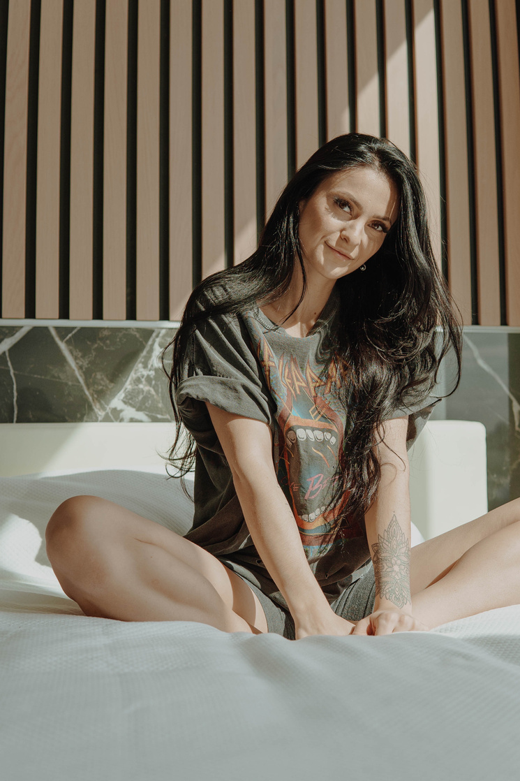 Woman in Black Shirt Sitting on Bathtub